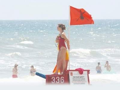 Volusia County officials strongly recommend ocean swimmers wade into the surf near a lifeguard. NEWS-JOURNAL FILE PHOTO