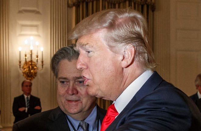 In this Feb. 3, 2017 file photo, President Donald Trump and White House chief strategist Steve Bannon are seen in the State Dining Room of the White House in Washington.