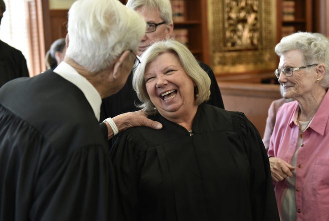 Circuit Court Judge Janette Dunnigan shares a laugh with retired Judge Gilbert A. Smith, Sr. on July 15, 2015. [HERALD-TRIBUNE STAFF PHOTO / THOMAS BENDER]