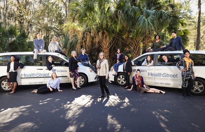 Linda Cottler, founder of HealthSreet, with her team of community health workers and experts who provide health care and research in Gainesville with an emphasis on the underserved population. [Photo by Rob C. Witzel]