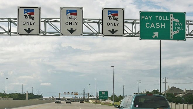 Motorists travel along the Highway 183-A toll road.