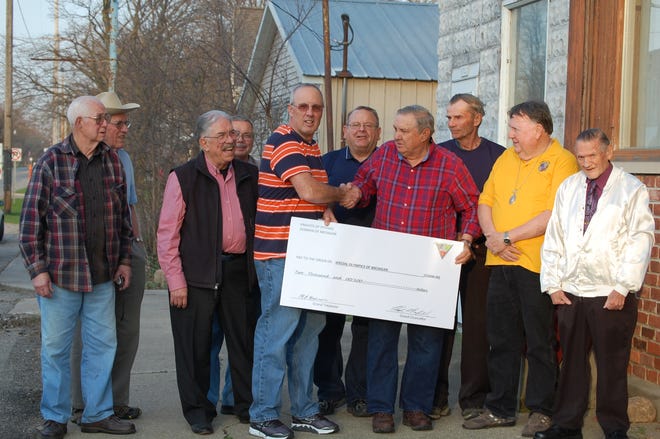 Special Olympics Area Director Gary Morrison (center) accepts a check from members of the Knights of Pythias Allen Lodge 230. Presenting the check is Financial Secretary Jack Johnson. [NANCY HASTINGS PHOTO]