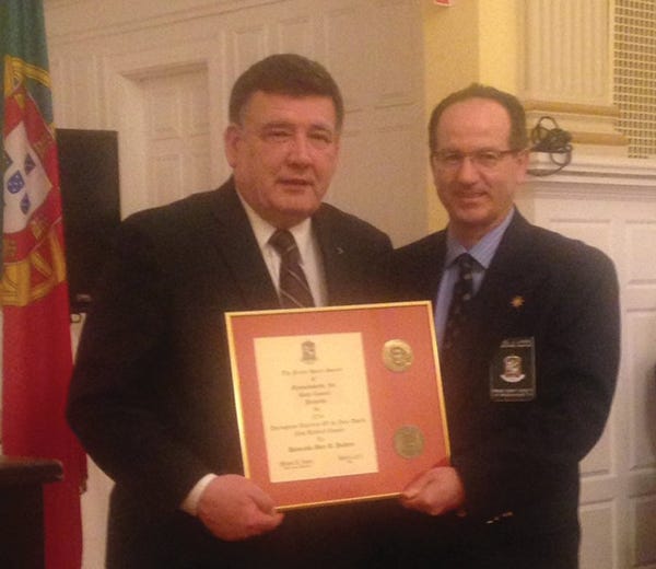 Manuel Louro, president of the Prince Henry Society of Massachusetts, at right, presents the Portuguese-American of the Year award from the Taunton chapter to Sen. Marc Pacheco.