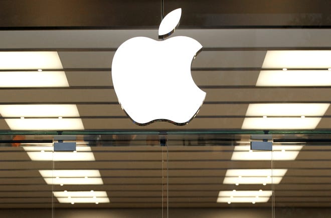 This Thursday, Sept. 19, 2013, file photo shows the Apple logo above a store location entrance, in Dallas. Apple will begin testing self-driving car technology in California, its first public move into a highly competitive field that could radically change transportation. The California Department of Motor Vehicles awarded Apple a permit to test autonomous vehicles Friday, April 14, 2017, and disclosed that information on its website. THE ASSOCIATED PRESS