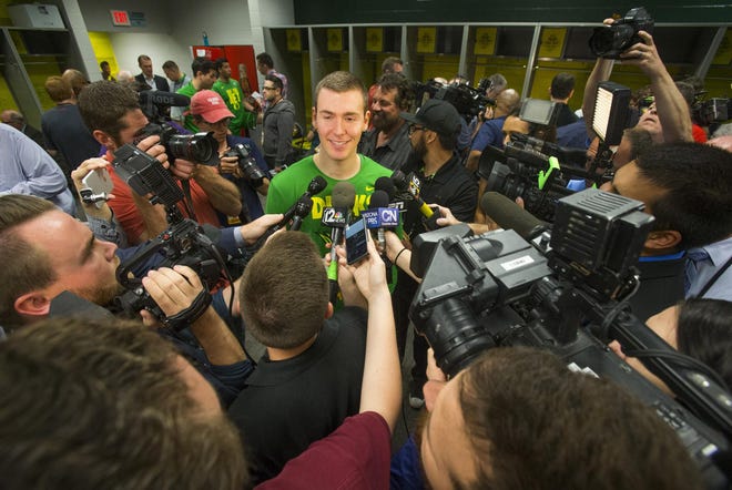 Oregon's Casey Benson attracts media attention during open locker room interviews for the team at University of Phoenix Stadium, site of the 2017 NCAA Final Four in Phoenix. Benson grew up in the area and is of interest to local media. The Ducks will play North Carolina on Saturday. (Andy Nelson/The Register-Guard)