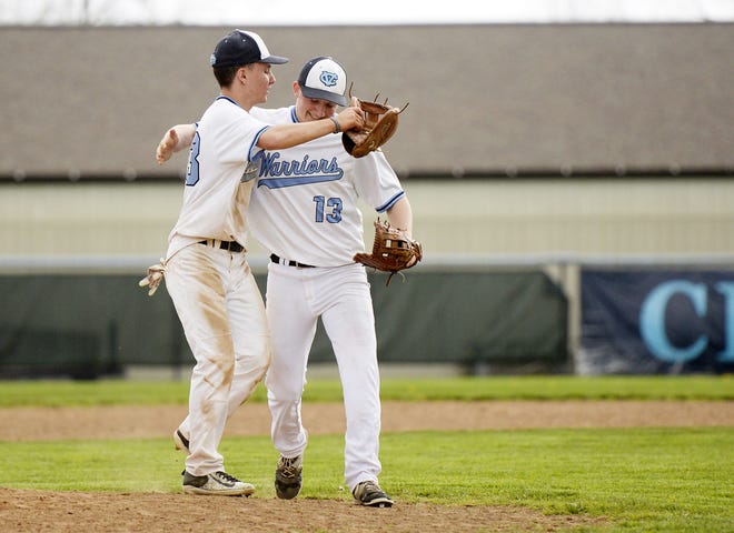 Central Valley's Mike Sittig and Jake Ramsey celebrate the Warriors' win against New Castle on Saturday at Central Valley High School.
