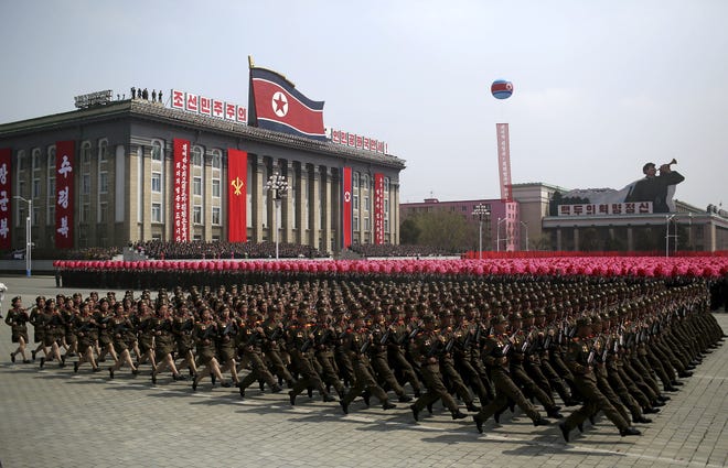 Soldiers march across Kim Il Sung Square during a military parade on Saturday in Pyongyang, North Korea to celebrate the 105th birth anniversary of Kim Il Sung, the country's late founder and grandfather of current ruler Kim Jong Un. [WONG MAYE-E / ASSOCIATED PRESS]