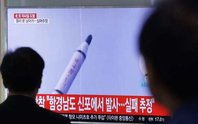 People watch a TV showing file footage of a North Korea's ballistic missile, at Seoul Railway Station in Seoul, South Korea, Sunday, April 16, 2017. A North Korean missile exploded during launch Sunday from the country's east coast, U.S. and South Korean officials said, a high-profile failure that comes as a powerful U.S. aircraft carrier approaches the Korean Peninsula in a show of force. The letters on the top read "North Korea's attempted missile launch failed." (AP Photo/Ahn Young-joon)