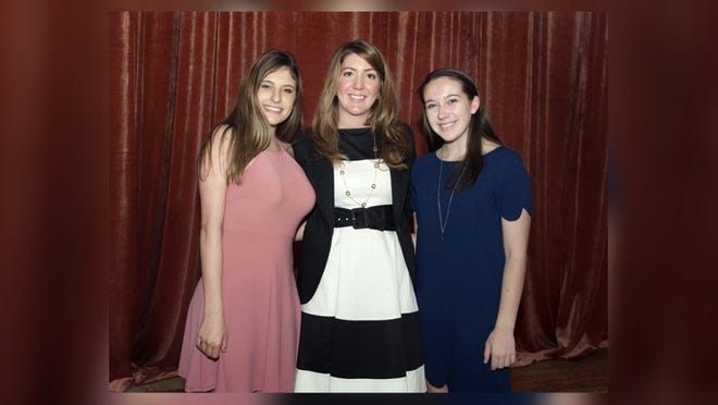 Brittany Mundarain, middle, presented Christina Caristo, left, and Corrine Allen with Neiman Marcus Scholarships during the Palm Beach Chamber of Commerce breakfast at The Breakers Thursday April 13, 2017. (Meghan McCarthy / Daily News)
