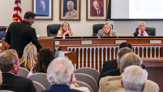 Jay Boodheshwar, deputy town manager, left, discusses the proposed Palm Beach Recreation Center Wednesday at Town Hall. Town Council members at right are Maggie Zeidman, Danielle Moore and Richard Kleid.