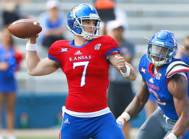 Team Jayhawks quarterback Peyton Bender throws a pass during the second half of Saturday afternoon’s Kansas football spring game at Memorial Stadium. Bender finished 11-for-15 passing with 143 yards and two touchdowns. (Chris Neal/The Capital-Journal)