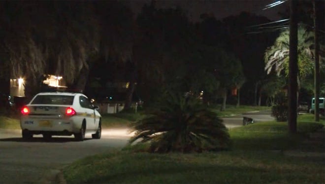 A Jacksonville Sheriff’s Office patrol car goes by Sunday night in Jacksonville’s Durkeeville Sunday night in the area where gunfire was heard. (First Coast News)