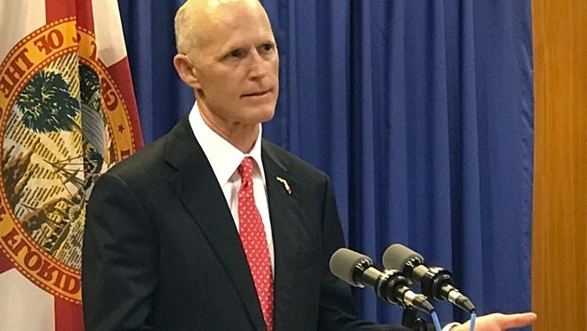 Florida Governor Rick Scott takes questions during a news conference on environmental issues at the state Capitol Monday, April 17, 2017, in Tallahassee, Fla. (AP Photo/Joe Reedy)