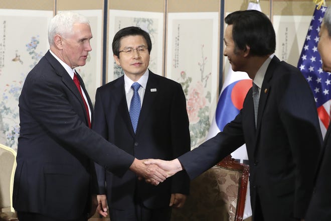 U.S. Vice President Mike Pence, left, shakes hands with South Korean Foreign Minister Yun Byung-se as South Korea's acting President and Prime Minister Hwang Kyo-ahn, center, stands prior to a meeting in Seoul, South Korea, Monday, April 17, 2017. Pence declared Monday the "era of strategic patience is over" with North Korea, expressing impatience with the unwillingness of the regime to move toward ridding itself of nuclear weapons and ballistic missiles. THE ASSOCIATED PRESS