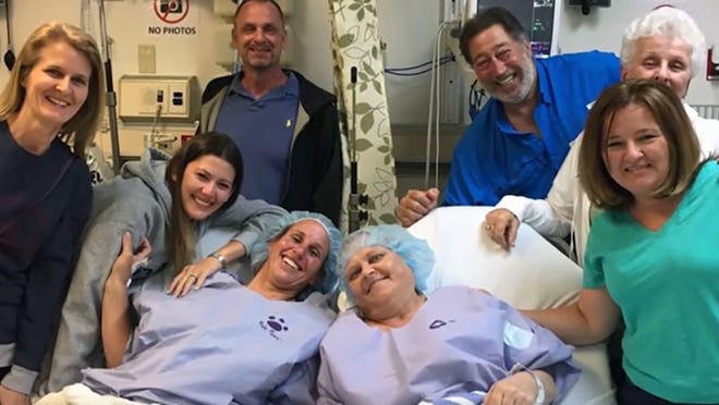 Michele Shaffer (center left), a K9 deputy with the Palm Beach County Sheriff’s Office, donated a kidney to Heidi Grob (center right), her PBSO colleague on April 10 at Jackson Memorial Hospital in Miami. ‘The body has things we don’t need,’ Shaffer says. ‘It has a spare kidney. And if I can save somebody’s life, then I’m going to try.’ (Photo courtesy of the Palm Beach County Sheriff’s Office)