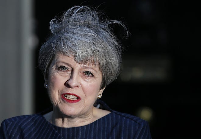 Britain's Prime Minister Theresa May speaks to the media outside her official residence of 10 Downing Street in London, Tuesday, April 18, 2017. May announced she will seek early election on June 8. THE ASSOCIATED PRESS