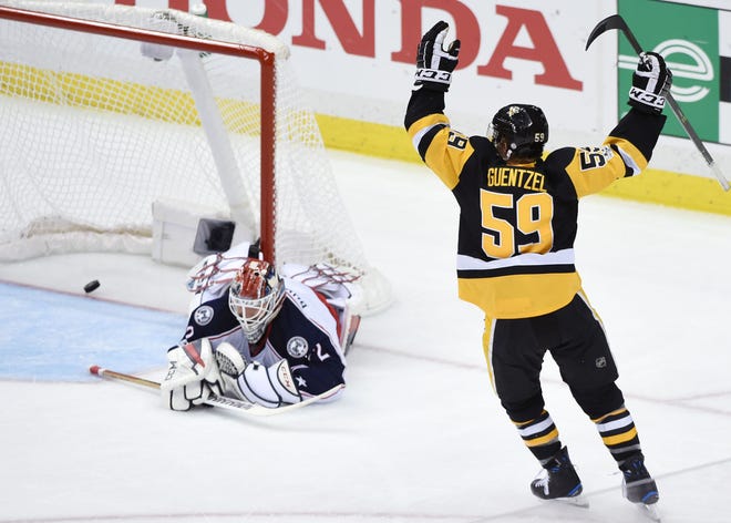 Jake Guentzel (59) celebrates his goal on the Blue Jackets' Sergei Bobrovsky (72) in the second period during Game 2 of the Pittsburgh Penguins' first-round Stanley Cup playoff series against the Columbus Blue Jackets Friday at PPG Paints Arena.