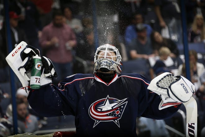 Blue Jackets goalie Sergei Bobrovsky sprays water as he takes the goal at the start of the second period of Game 4 on Tuesday at Nationwide Arena. [Adam Cairns/Dispatch]