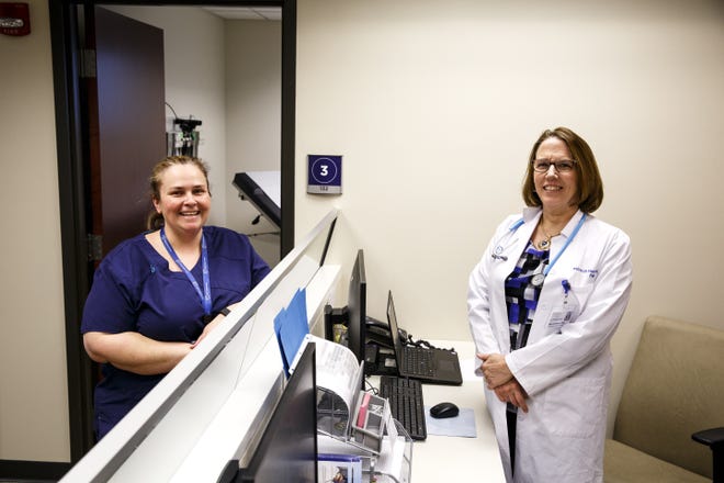 At a new clinic opened last month for city employees run by HSHS Medical Group, Rose McCoy, left, a certified medical assistant, and Deborah Horton, family nurse practitioner, administer basic medical and preventive care, wellness services and lab work. [Rich Saal/The State Journal-Register]