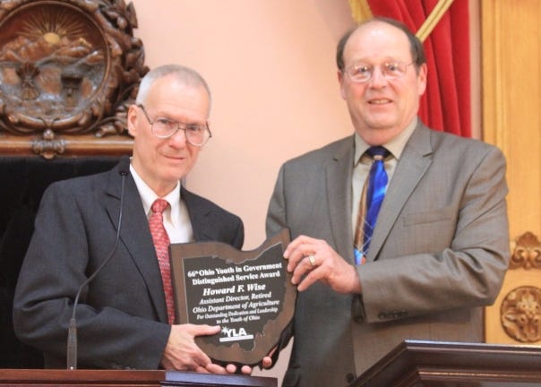 The Ohio-West Virginia Youth Leadership Association presented the Distinguished Service Award to New Philadelphia native Howard F. Wise on April 6. Pictured: Wise, left, receives the award from Ohio Department of Agriculture Director David T. Daniels. PHOTO PROVIDED