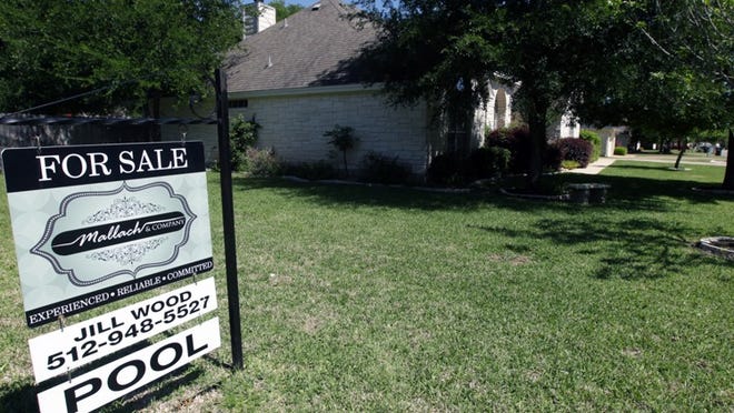 A “For Sale” sign sits outside this Georgetown home on April 7. Home sales for the Austin metro area dipped a bit in March, according to the Austin Board of RealtorsNicole Barrios/American-Statesman
