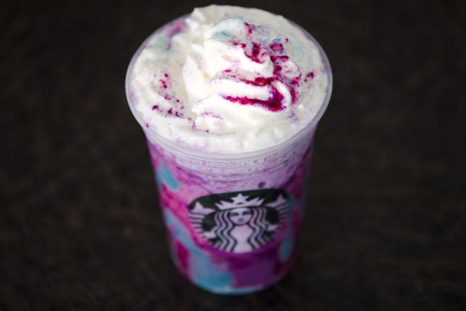 A Starbucks Unicorn Frappuccino drink sits on display, Thursday, April 20, 2017, in Philadelphia. Starbucks' entry into the unicorn food craze was released Wednesday and its popularity was too much for Colorado barista Braden Burson. THE ASSOCIATED PRESS