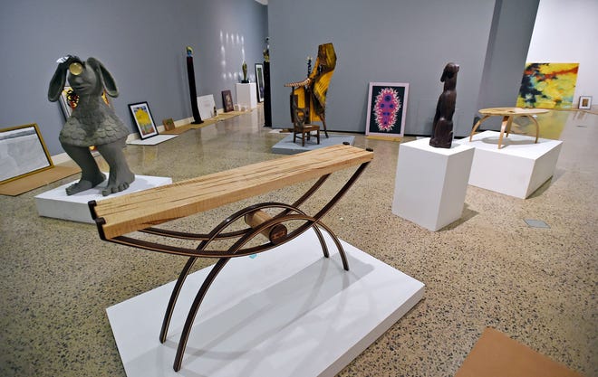 Pieces began being arranged and hung Tuesday in preparation for the Erie Art Museum's 94th annual Spring Show. [DAVE MUNCH/ERIE TIMES-NEWS]