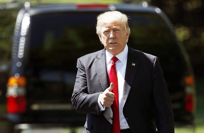 In this April 18 file photo, President Donald Trump gives a thumbs-up as he walks to board Marine One on the South Lawn of the White House in Washington, for the short trip to Andrews Air Force Base, Md., en route to Kenosha, Wis. Trump, the “America First” president who vowed to extricate the U.S. from onerous overseas commitments, appears to be warming up to the view that when it comes to global agreements, a deal’s a deal. [CAROLYN KASTER/AP]
