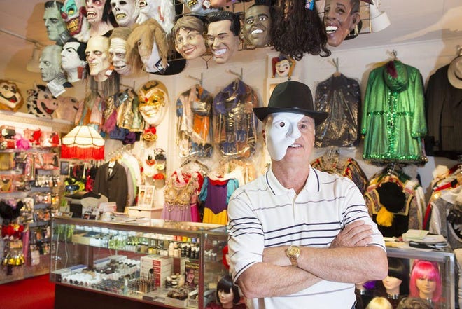 RON JOHNSON/JOURNAL STAR FILE PHOTO Steve Spain owns The Costume Trunk on Main Street. The shop carries specialty costumes and accessories including wigs, hats and masks.