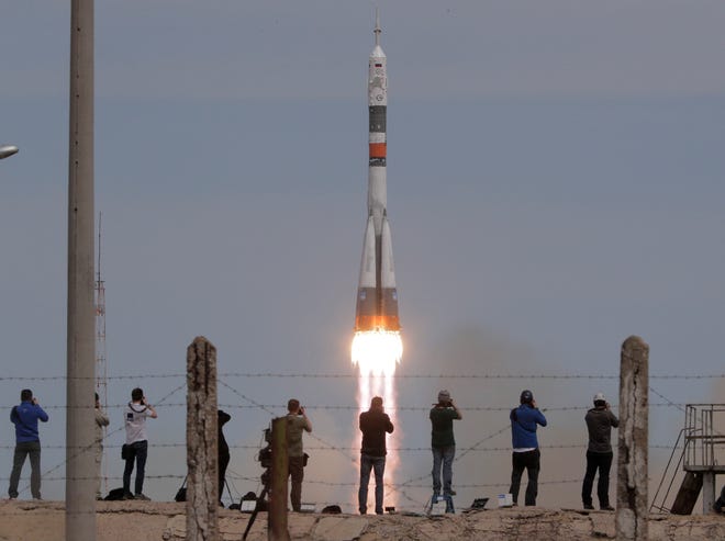 The Soyuz-FG rocket booster with Soyuz MS-04 spacecraft carrying a new crew to the International Space Station, ISS, blasts off at the Russian leased Baikonur cosmodrome, Kazakhstan, Thursday, April 20, 2017. The Russian rocket carries U.S. astronaut Jack Fischer and Russian cosmonaut Fyodor Yurchikhin. (AP Photo/Dmitri Lovetsky)