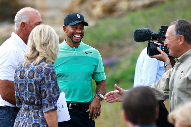 Tiger Woods smiles during a press event for a new golf course designed by Woods, in Hollister, Mo., Tuesday, April 18, 2017. (Guillermo Martinez/The Springfield News-Leader via AP)
