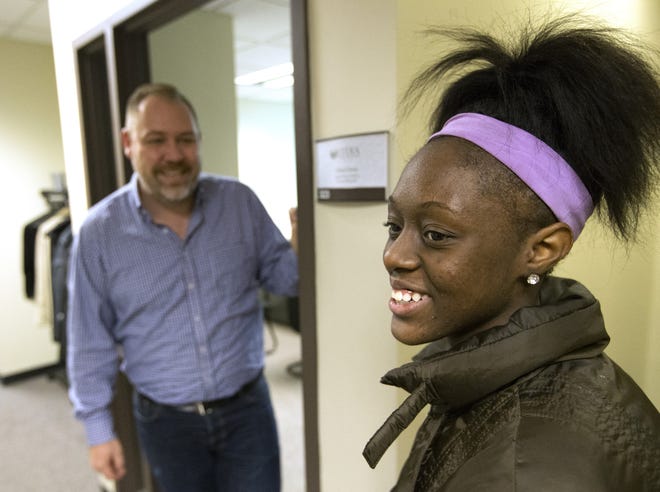 Jazmonique Holmes, 16, a senior at Lydia Urban Academy, meets with Principal Chad Craty on Dec. 2. The nonprofit alternative high school was in danger of closing in December, but officials were able to raise $60,000 to keep it open. RRSTAR.COM/FILE PHOTO