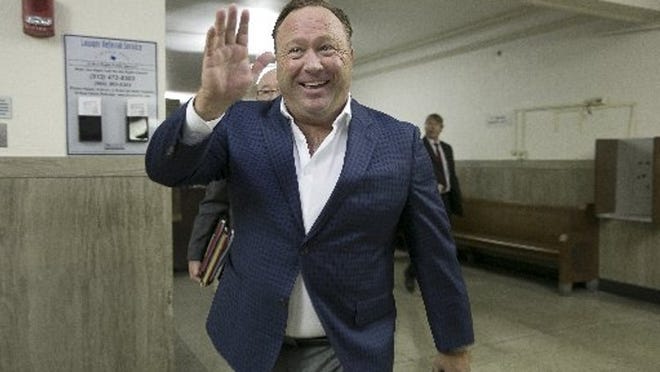 Alex Jones heads to court after a break on Thursday at the Travis County Courthouse.