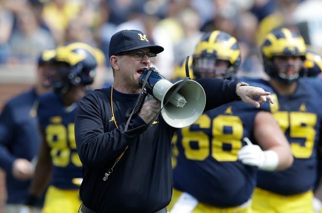 Coaches like Michigan's Jim Harbaugh reveal little of their gameplans during spring football. [AP Photo/Carlos Osorio]