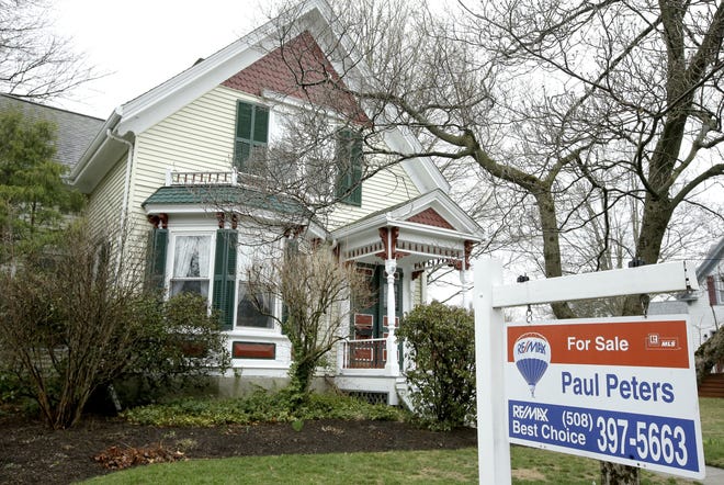 This Wednesday, April 12, 2017, photo shows a home for sale, in Natick, Mass. Americans purchased homes in March at the fastest pace in over a decade, a strong start to the traditional spring buying season. (AP Photo/Steven Senne)
