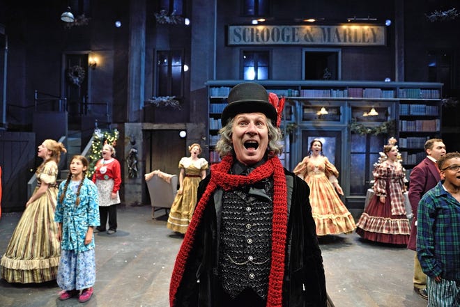 Brian McEleney as Ebenezer Scrooge with the ensemble of "A Christmas Carol" in 2016. [Trinity Rep / Mark Turek]