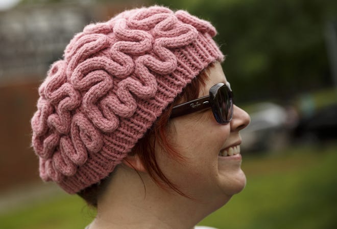 Anne Herdman Royal wears a brain hat during the March for Science on Saturday, April 22, 2017, in Chattanooga, Tenn. About a thousand demonstrators marched from the Main Terrain Art Park to Riverfront Parkway and back in support of science and education in solidarity with other marches nationwide. (Doug Strickland/Chattanooga Times Free Press via AP)