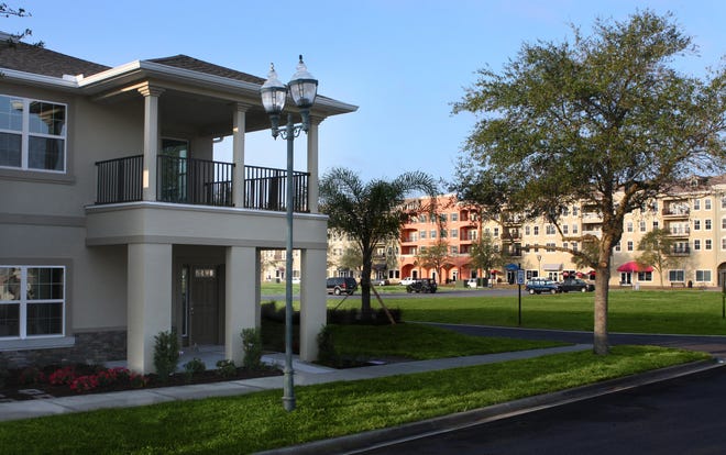 This is the exterior of the end unit at the Fountains East Townhomes at Venetian Bay in New Smyrna Beach that won the Top Score Multi Family Home Award for the Volusia Building Industry Association's 2017 Parade of Homes. [Image courtesy Platinum Builders]