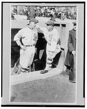 PHOTO COURTESY LIBRARY OF CONGRESS In this 1917 photo, Pants Rowland, manager of the Chicago White Sox, (right) talks with pitcher Eddie Cicotte during a game.