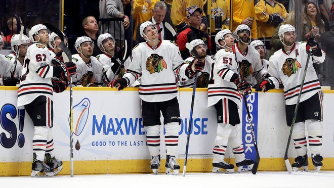 Chicago Blackhawks watch as a goal by the Nashville Predators is reviewed during the third period in Game 4 of a first-round NHL hockey playoff series Thursday, April 20, 2017, in Nashville, Tenn. The goal was ruled good. The Predators won 4-1 and swept the series. (AP Photo/Mark Humphrey)