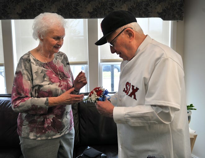 Ed Roth, chairman of the Milford Council on Aging, gives a wrist corsage to Milford 2017 Senior of the Year Gail Brown before escorting her into the 2017 Senior of the Year & Volunteer Recognition Luncheon at the senior center on Friday.

[Daily News and Wicked Local Staff Photo/ Allan Jung]