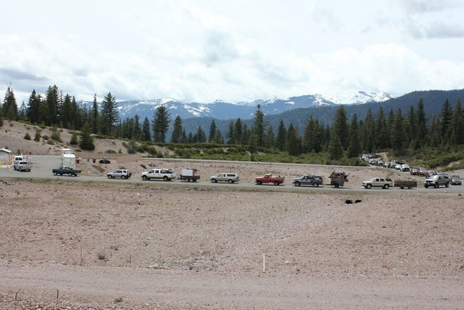 The line of vehicles was long for the free dump day at Black Butte Transfer Station in Mount Shasta on Earth Day 2017, Saturday, April 22. The line wrapped all the way around the entrance to the transfer station and was about 9 to 10 vehicles deep on Spring Hill Dr. in the early afternoon. The slow procession to the kiosk was taking about 45 minutes to an hour.
