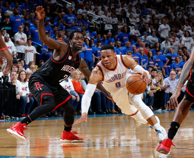 Oklahoma City's Russell Westbrook (0) looks to get by Houston's Patrick Beverley (2) during Game 3 in the first round of the NBA basketball playoffs between the Oklahoma City Thunder and the Houston Rockets at Chesapeake Energy Arena in Oklahoma City, Friday, April 21, 2017. Photo by Nate Billings, The Oklahoman