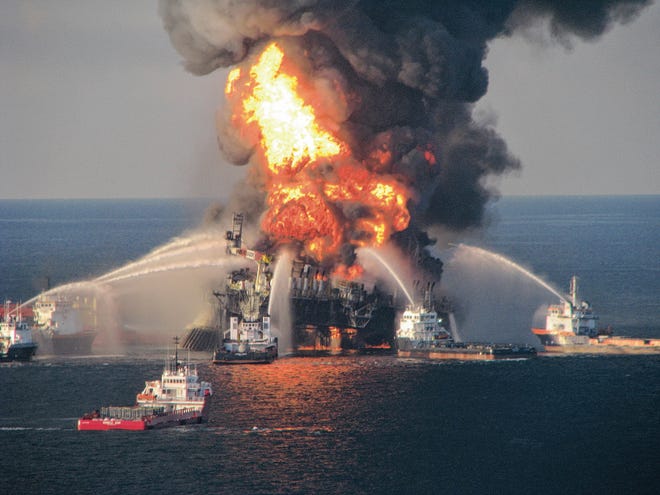 Fire boat response crews spray water on the blazing remnants of BP’s Deepwater Horizon offshore oil rig April 21, 2010. Florida lawmakers are in final negotiations on the fate of millions slated to be directed to Triumph Gulf Coast. [U.S. COAST GUARD/ASSOCIATED PRESS FILE PHOTO]