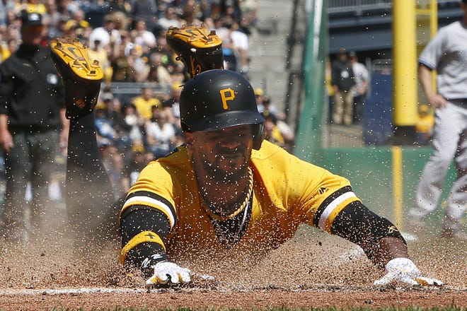 The Pirates' Andrew McCutchen scores on a double by Gregory Polanco off Yankees starting pitcher Jordan Montgomery in the third inning Sunday in Pittsburgh.