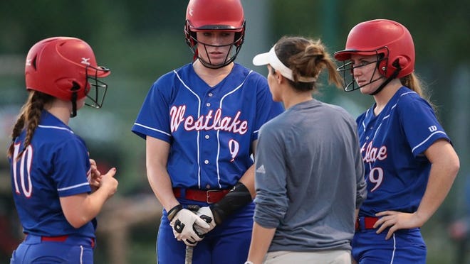 Westlake head softball coach Haley Gaddis talks with batter Jillian Hefner (9) and players Juliana Brown (10) and Sarah Hildreth (19) during their matchup against Vista Ridge on Friday, April 21, 2017. Jamie Harms / for Round Rock Leader
