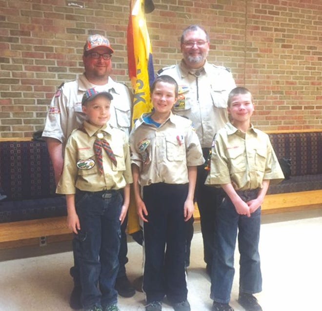 Both Assistant Cub Master Joe Hresja (back left) and Cub Scout Pack Master Frank Holes Jr. (Back right) earned awards at the Northern Trails District recognition dinner for their work with Cub Scout Pack 204.