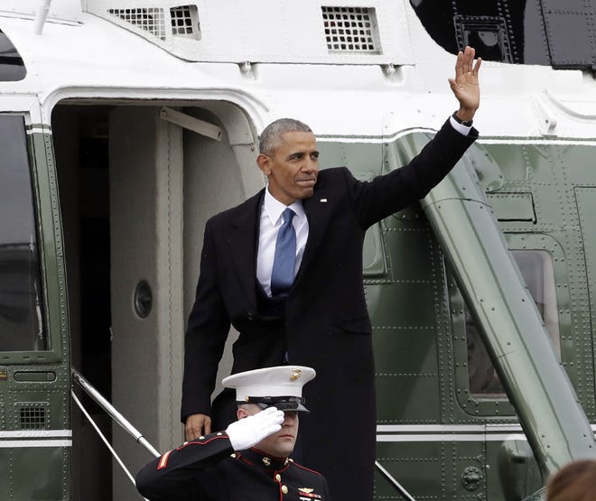 In this Jan. 20, 2017, file photo, former President Barack Obama waves as he boards a Marine helicopter during a departure ceremony on the East Front of the U.S. Capitol in Washington after President Donald Trump was inaugurated. Obama is scheduled to hold the first public event of his post-presidential life Monday, April 24, 2017, in the place where he started his political career. He will speak at the University of Chicago, where his presidential library is planned. THE ASSOCIATED PRESS