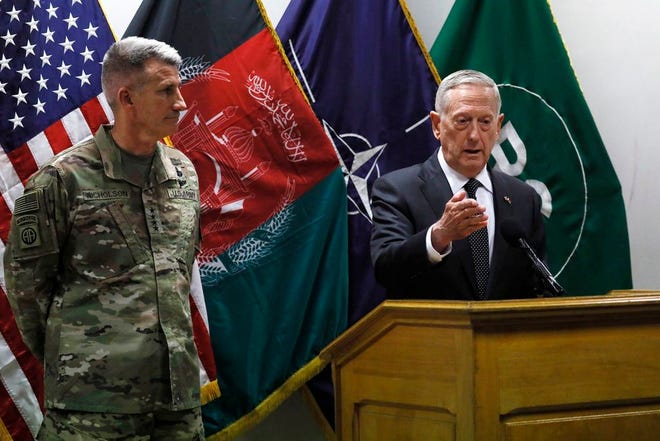 U.S. Defense Secretary James Mattis , right, and U.S. Army General John Nicholson, left, commander of U.S. Forces Afghanistan, hold a news conference at Resolute Support headquarters in Kabul, Afghanistan, Monday, April 24, 2017. Mattis arrived unannounced in Afghanistan to assess America's longest war as the Trump administration weighs sending more U.S. troops.