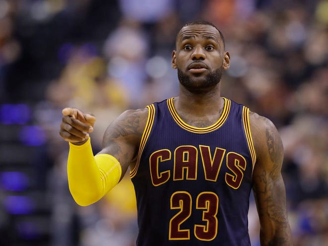 Cleveland Cavaliers' LeBron James instructs teammates during the first half in Game 4 of a first-round NBA basketball playoff series against the Indiana Pacers, Sunday, April 23, 2017, in Indianapolis. (AP Photo/Darron Cummings)